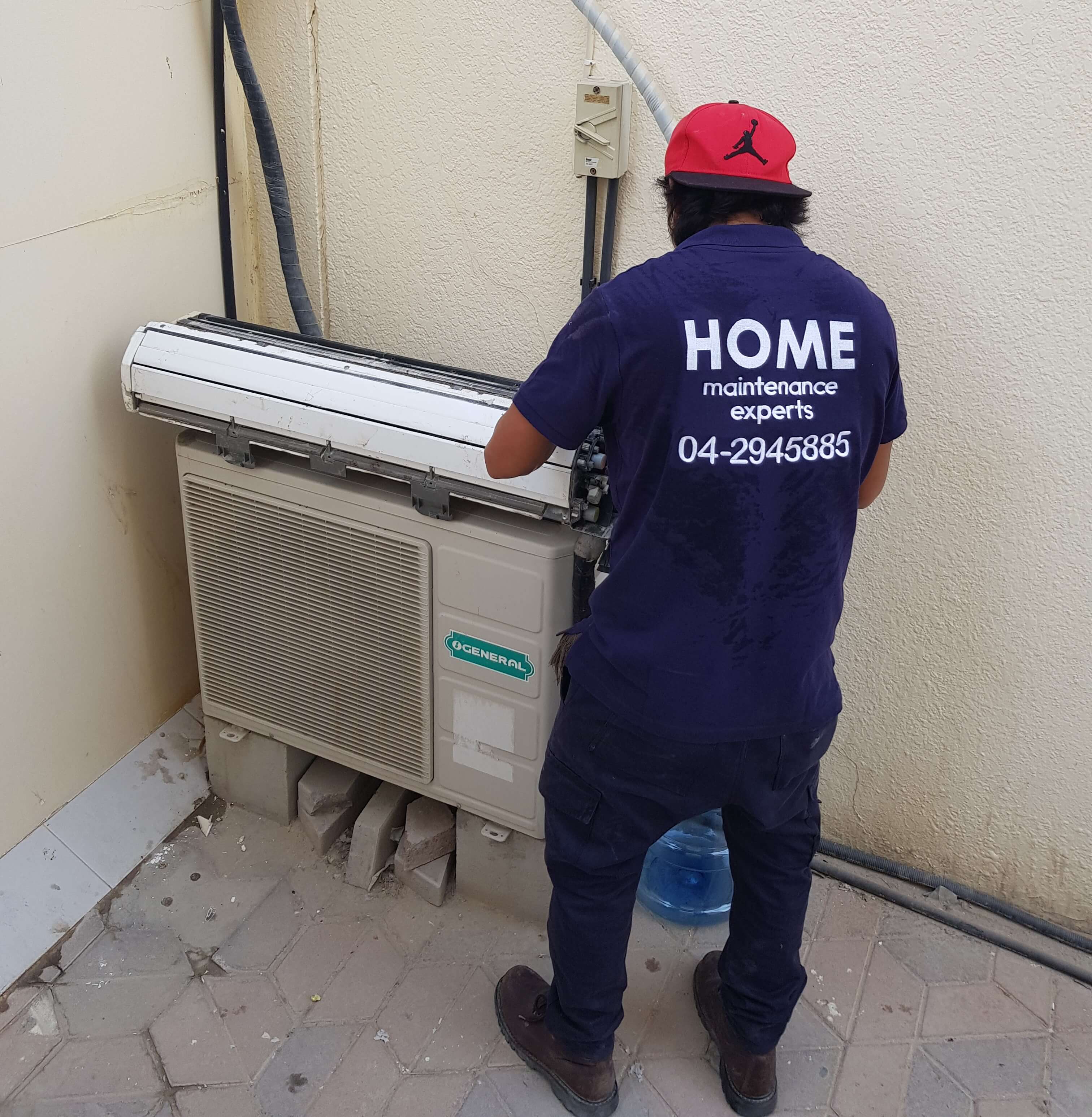 Technician servicing an AC system