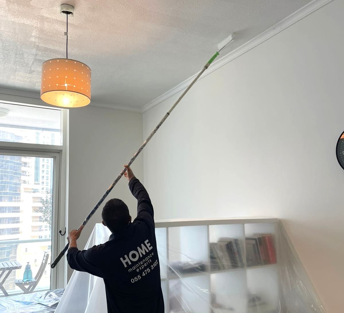 Professional painters applying a clean interior finish